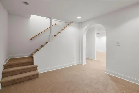 a backyard of a house with yard barbeque oven and outdoor seating