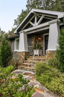 a view of a house with yard and garden