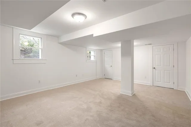 a view of a house with backyard swimming pool and sitting area