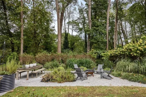 a backyard of a house with lots of green space
