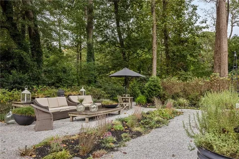 a view of a backyard with swimming pool