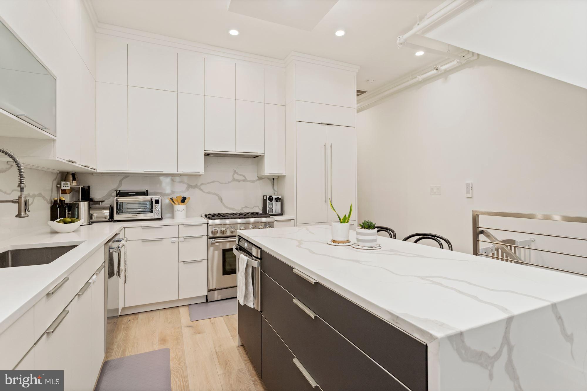 74 R Street Northwest, Unit 1 Washington, DC 20001 - Photo 3 of 36 Sleek, modern kitchen with Leicht cabinetry