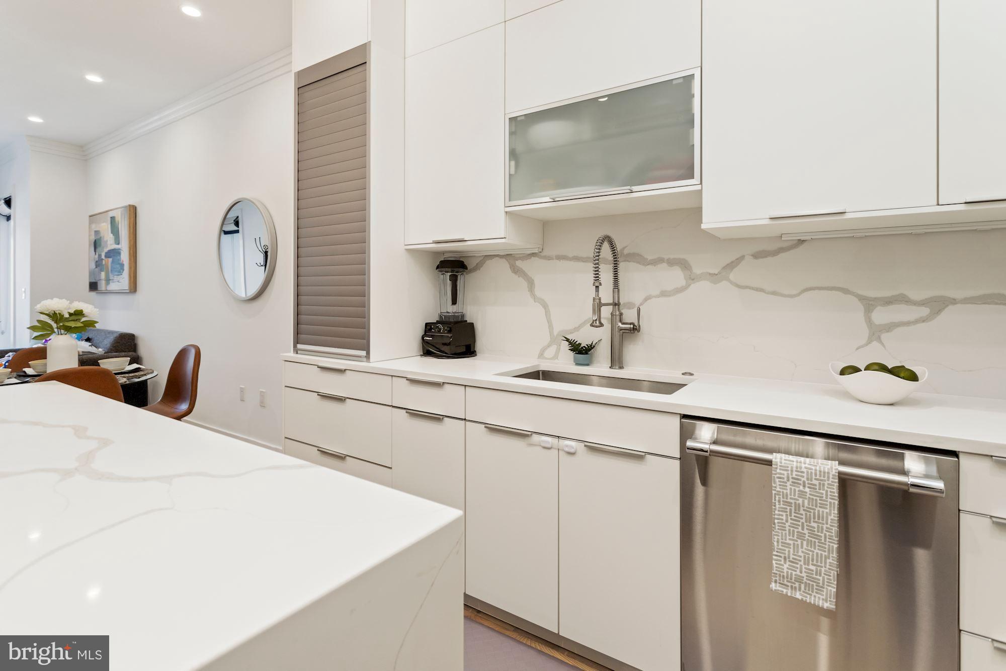 74 R Street Northwest, Unit 1 Washington, DC 20001 - Photo 5 of 36 Gorgeous quartz countertops and backsplash