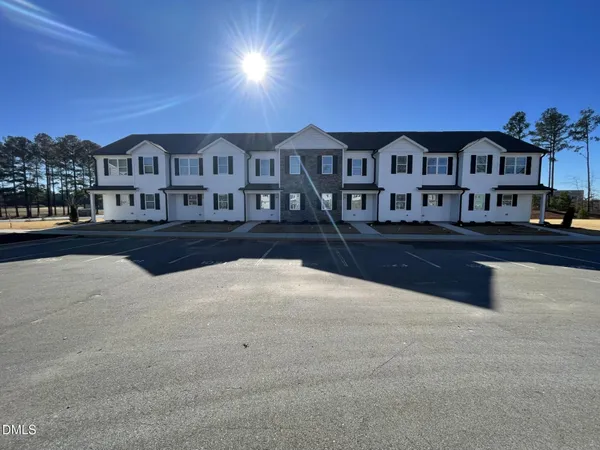 a front view of a building with street view