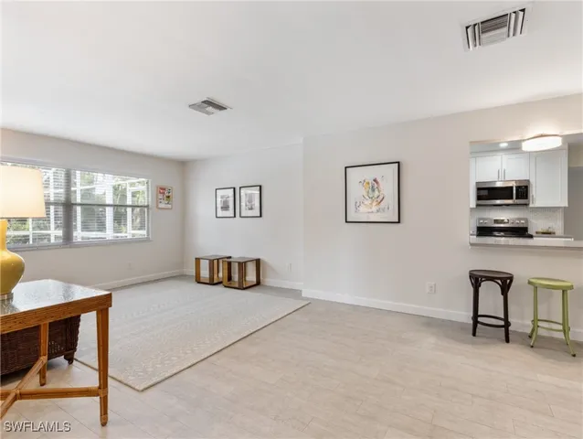 a living room with furniture and a couch
