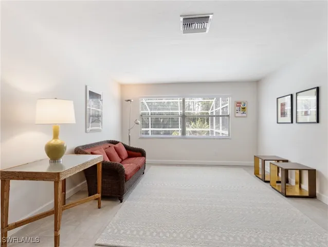 an empty room with a empty space and a ceiling fan