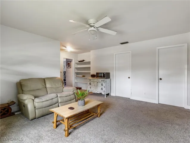 a living room with furniture and a couch