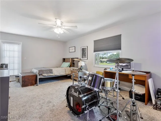 a bathroom with a double vanity sink a shower and a mirror