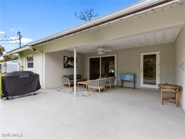 a view of a swimming pool with a patio