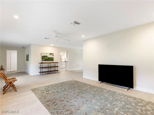 a view of a livingroom with furniture and window