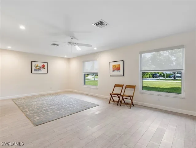 a view of a dining room with furniture window and outside view