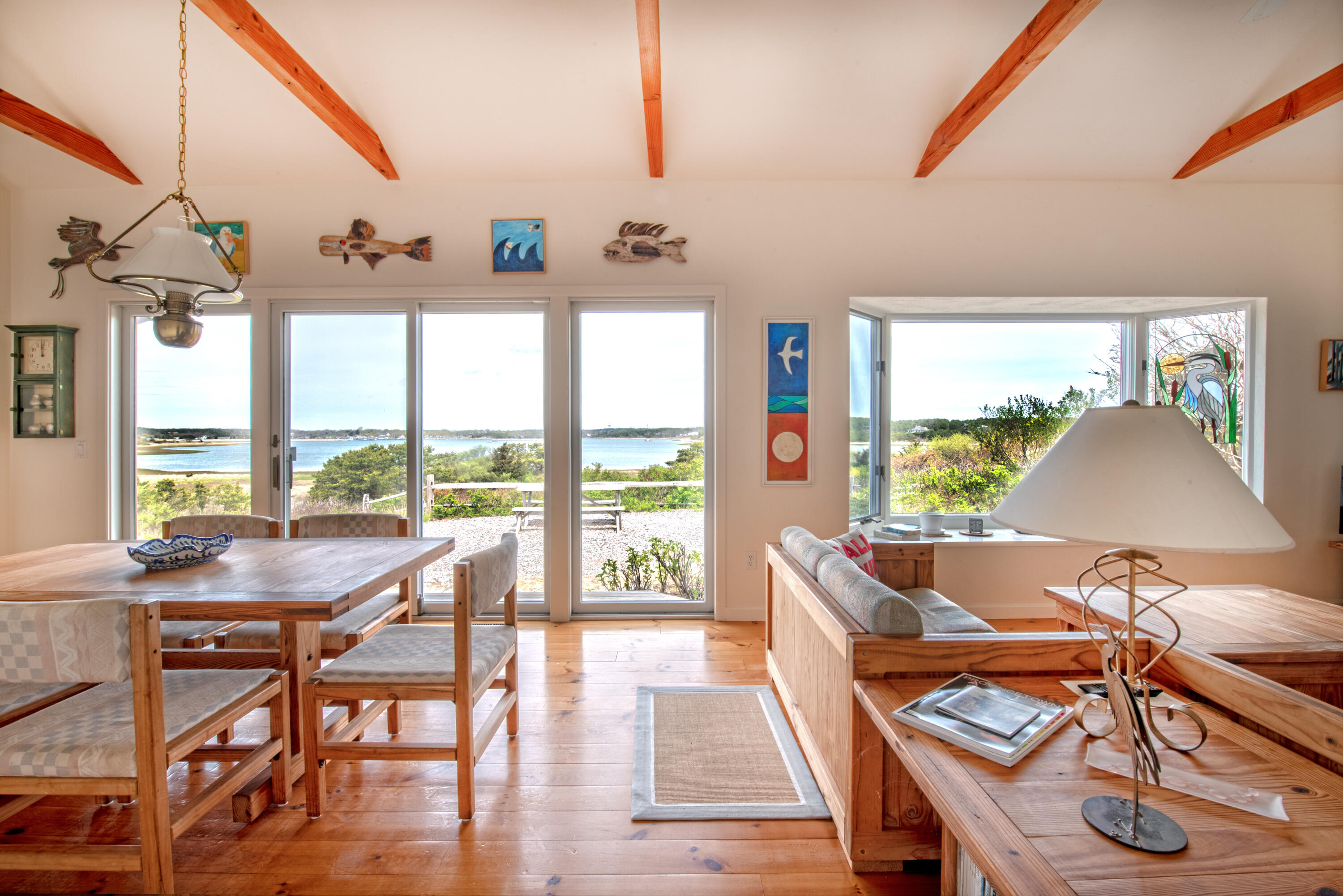 40 Ione Road Wellfleet, MA 02667 - Photo 15 of 30 a view of a dining room with furniture window and outside view