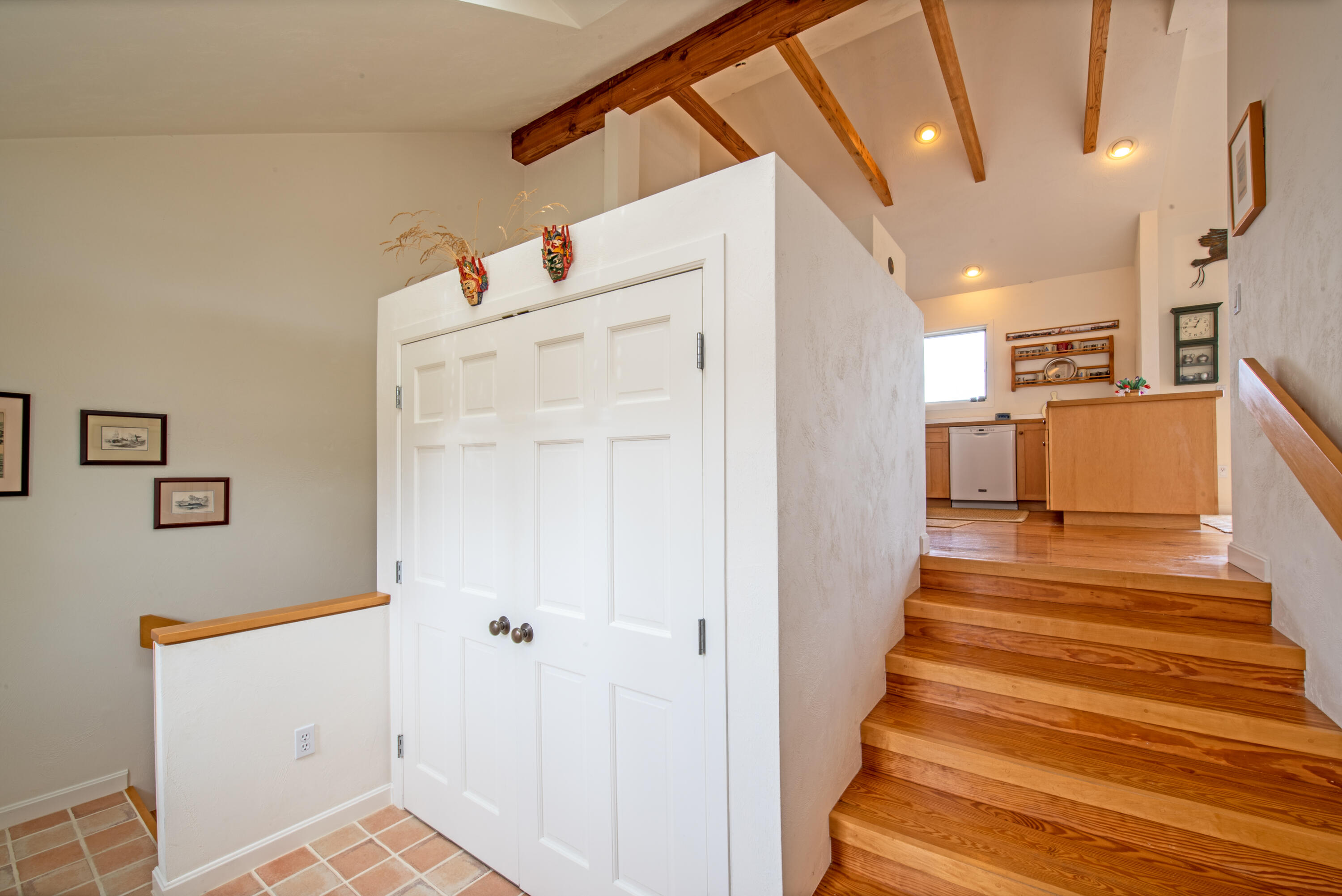 40 Ione Road Wellfleet, MA 02667 - Photo 22 of 30 a view of a hallway with wooden cabinets and staircase