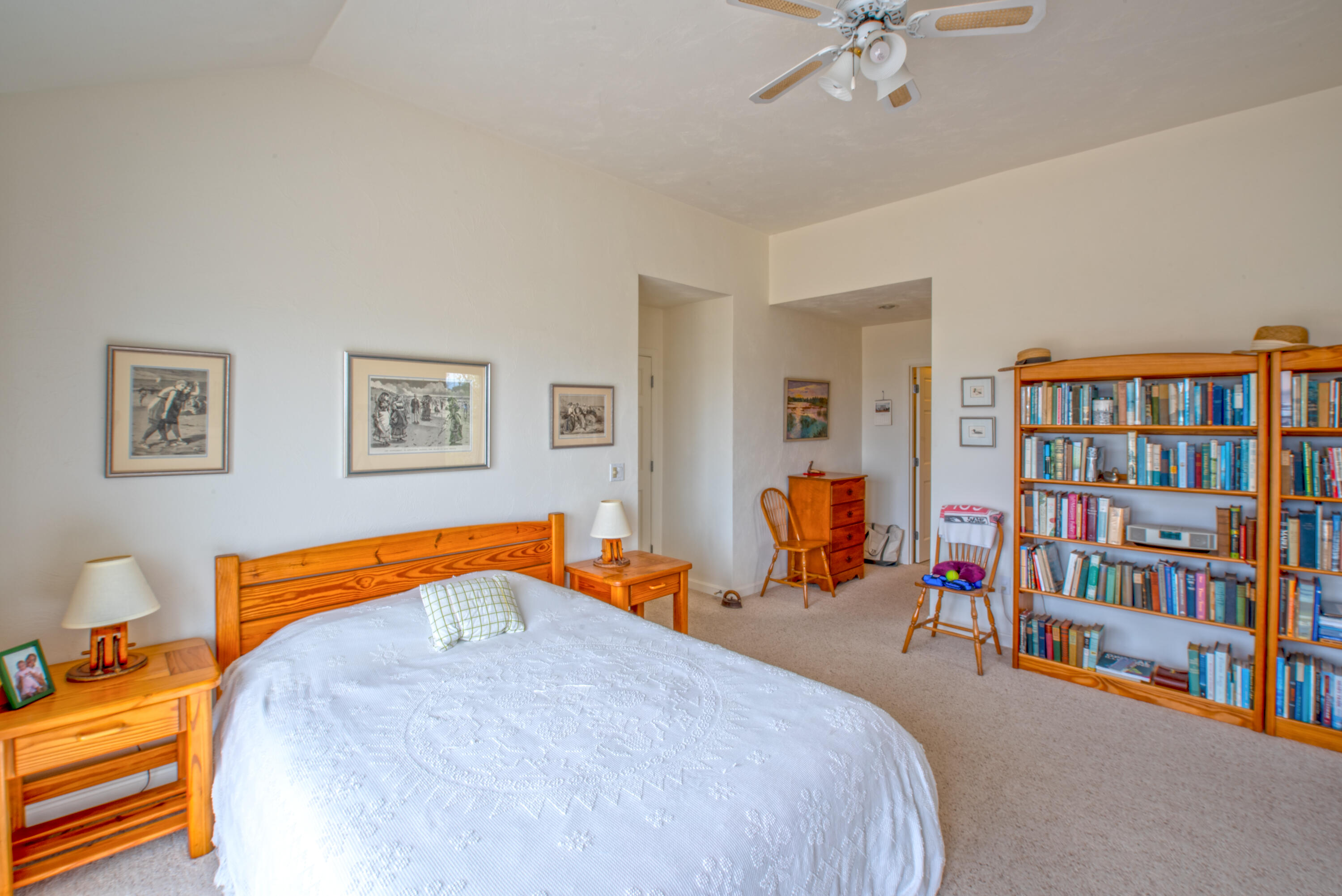 40 Ione Road Wellfleet, MA 02667 - Photo 25 of 30 a bedroom with a bed and a book shelf
