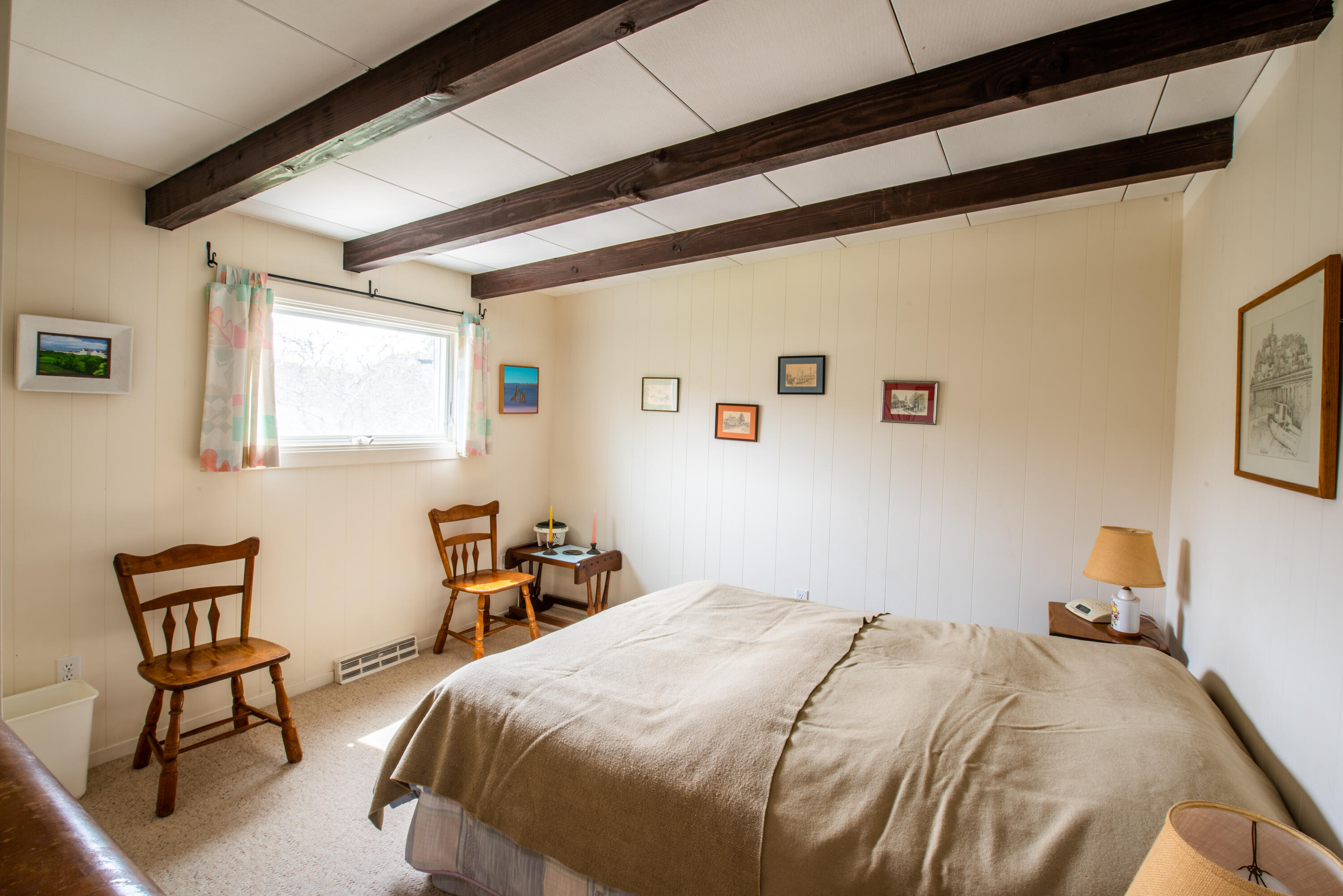 40 Ione Road Wellfleet, MA 02667 - Photo 26 of 30 a bedroom with a bed and chair