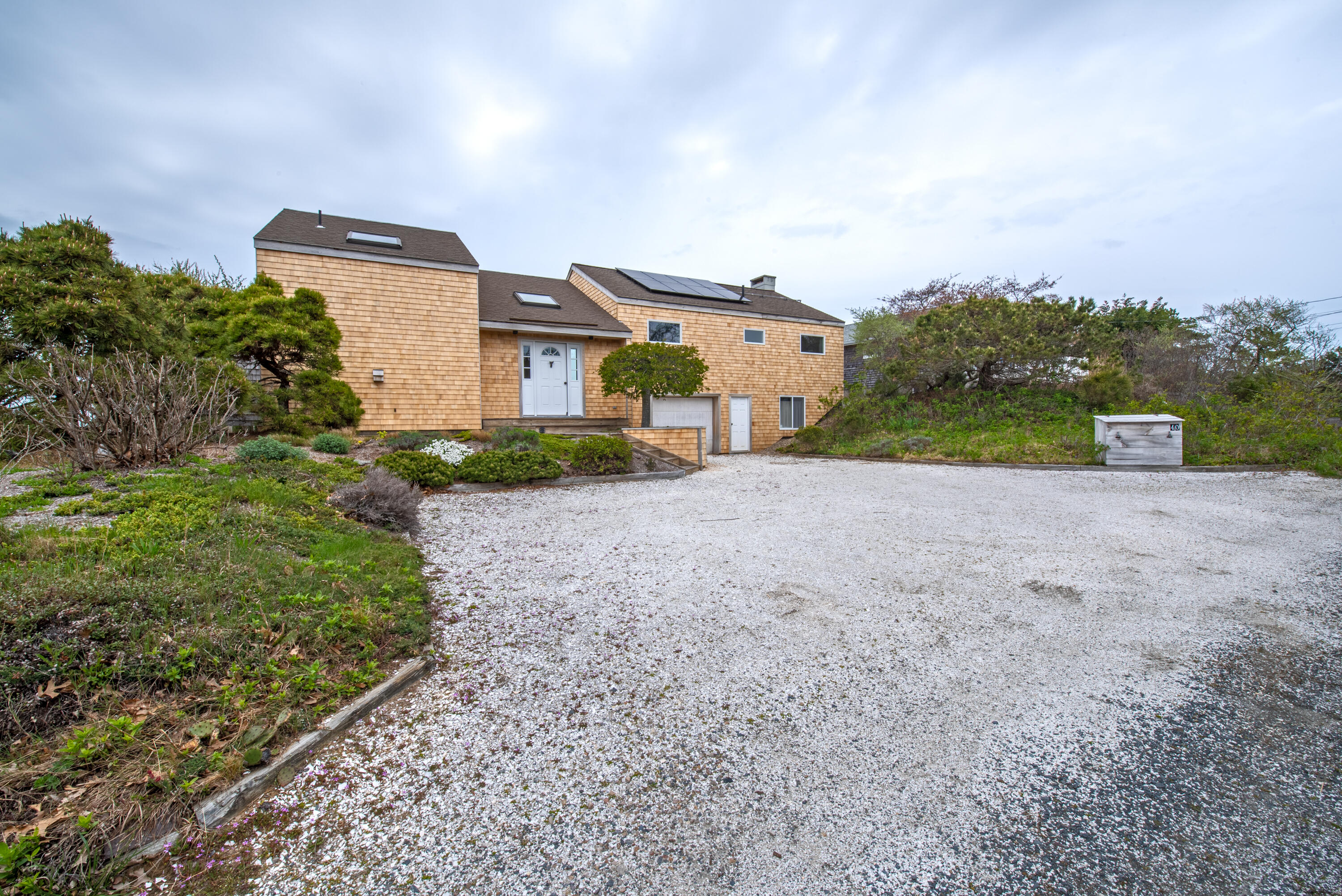 40 Ione Road Wellfleet, MA 02667 - Photo 7 of 30 a view of a house with a yard
