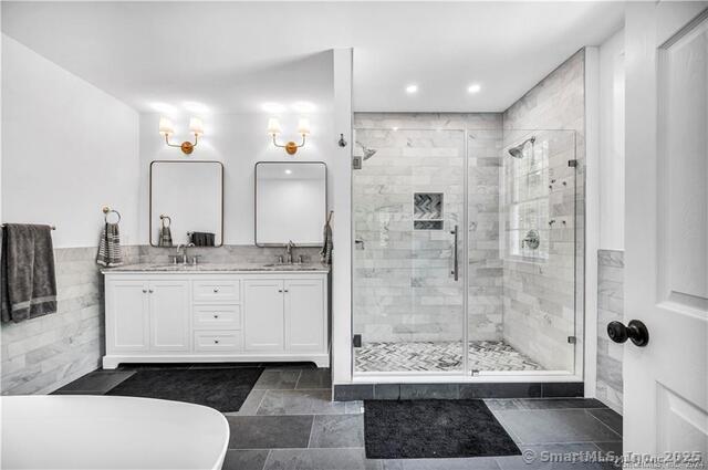 454 Horse Pond Road, Unit D Madison, CT 06443 - Photo 6 of 9 a bathroom with a sink a toilet and shower