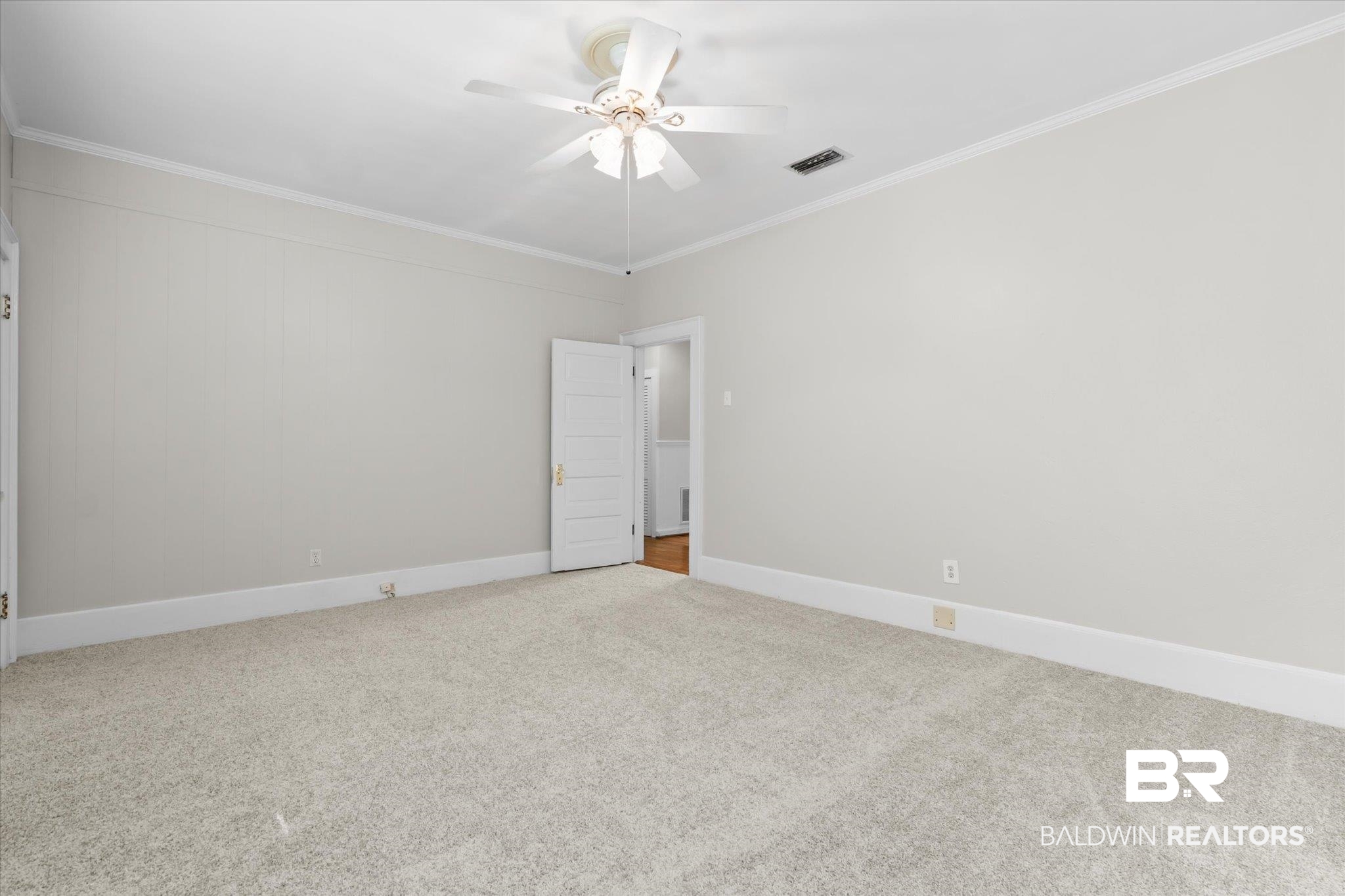 211 3rd Street Mobile, AL 36611 - Photo 13 of 20 Empty room featuring crown molding, carpet, and ceiling fan