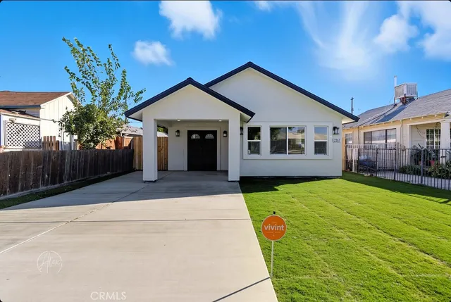 a front view of a house with yard