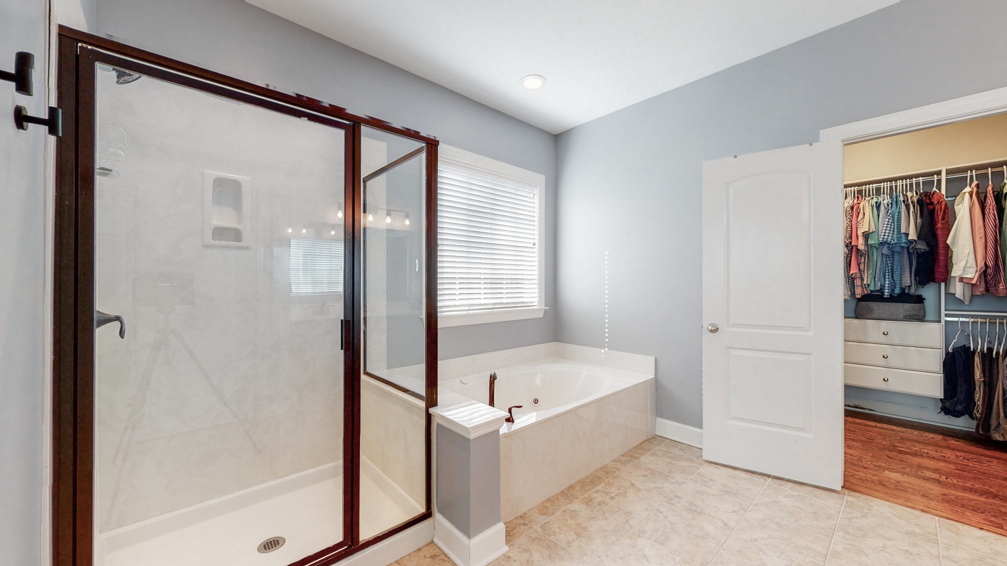 6137 Stags Leap Way Franklin, TN 37064 - Photo 15 of 24 a bathroom with a bathtub and a shower
