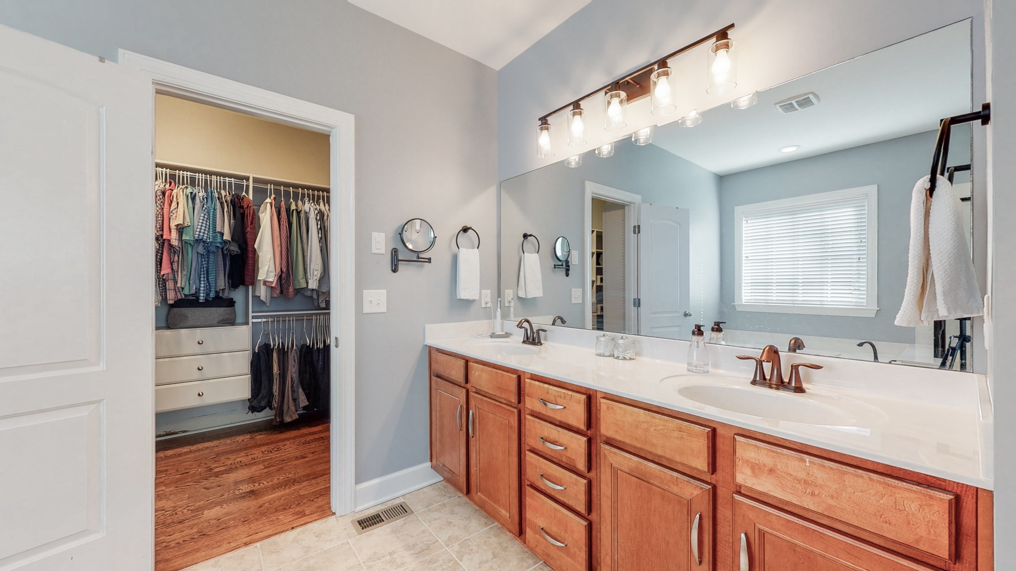 6137 Stags Leap Way Franklin, TN 37064 - Photo 16 of 24 a spacious bathroom with a double vanity sink a mirror and a shower