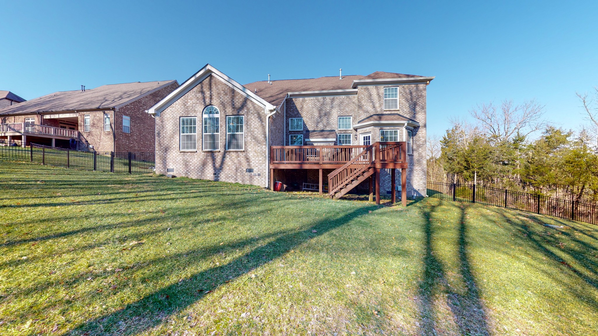 6137 Stags Leap Way Franklin, TN 37064 - Photo 3 of 24 a view of a house with a big yard and large trees