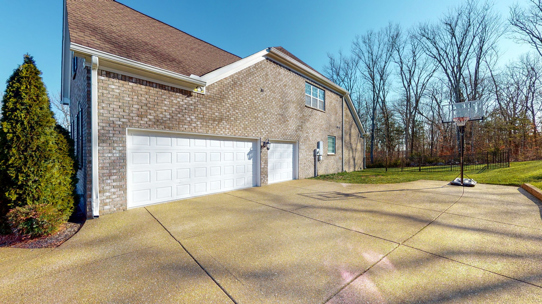 6137 Stags Leap Way Franklin, TN 37064 - Photo 4 of 24 a view of a house with a yard and garage