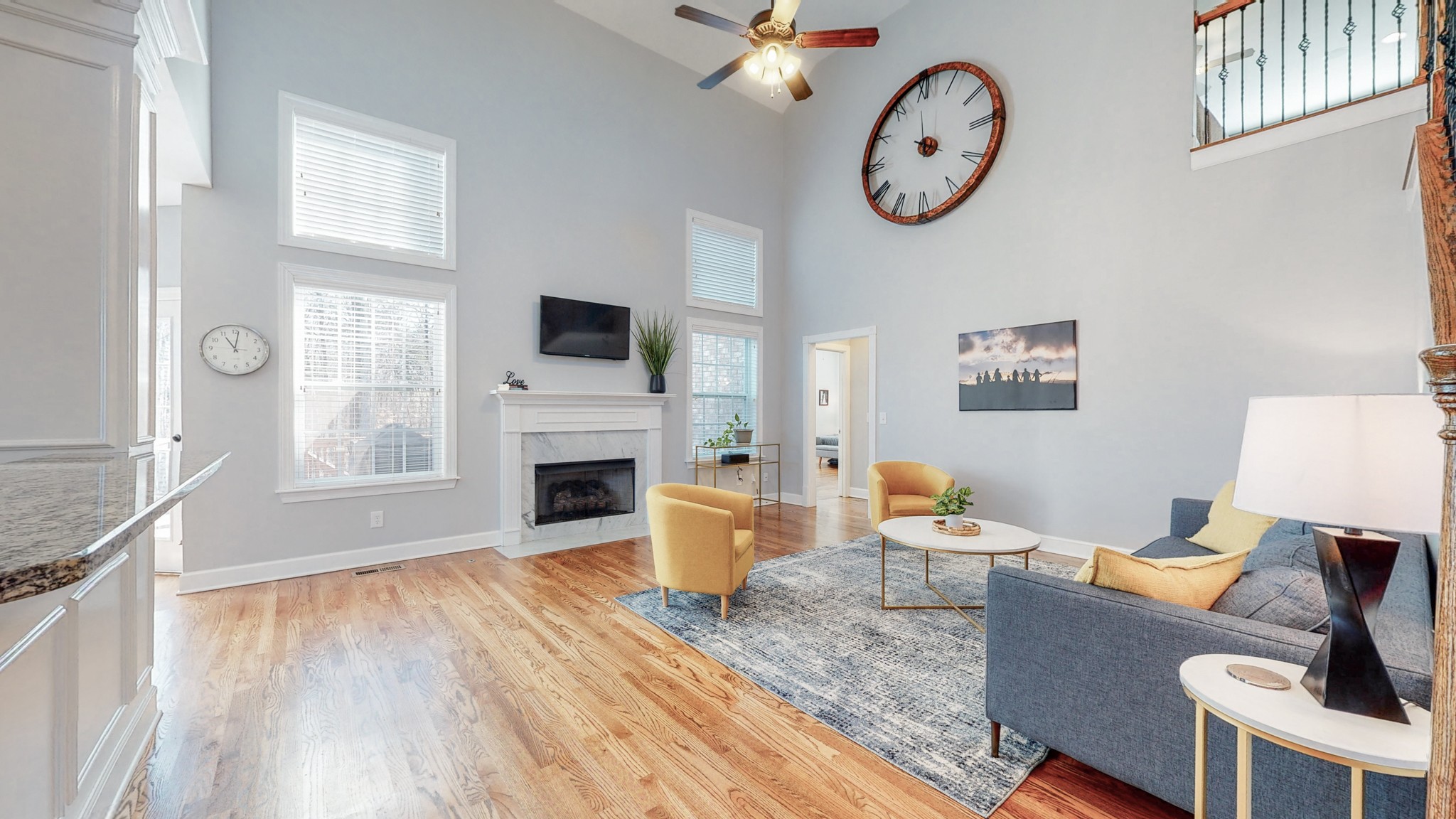 6137 Stags Leap Way Franklin, TN 37064 - Photo 6 of 24 a living room with furniture a fireplace and a flat screen tv