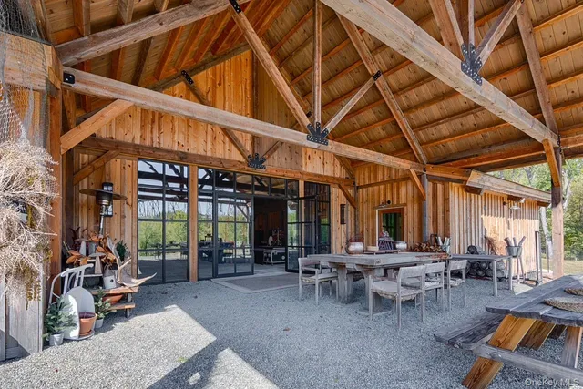 a view of a backyard with sitting area