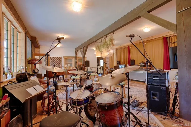 a view of a room with gym equipment and floor to ceiling window