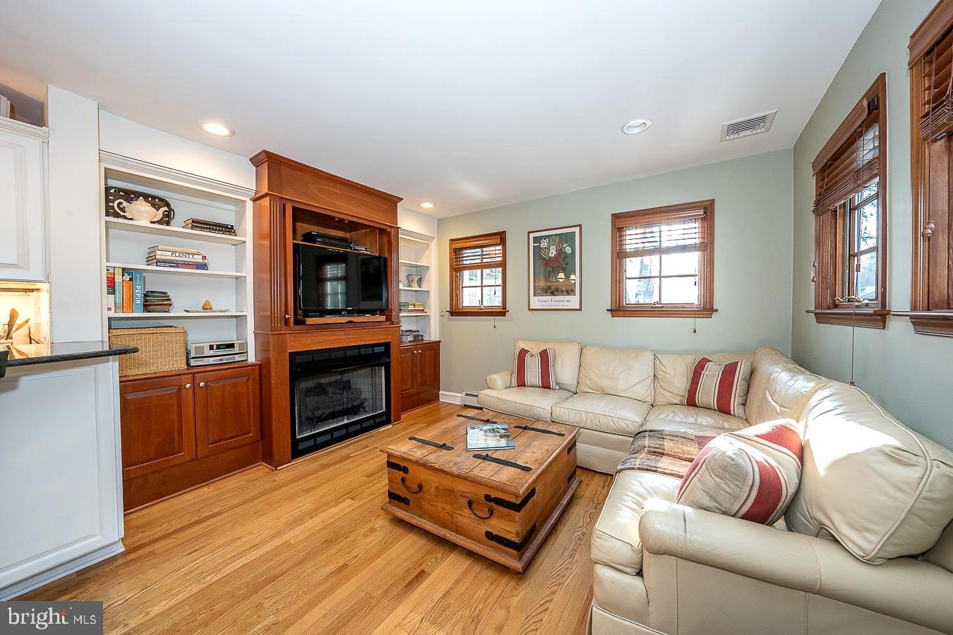 1002 Twyckenham Road Media, PA 19063 - Photo 16 of 45 Family Room with built-in cabinet & gas fireplace