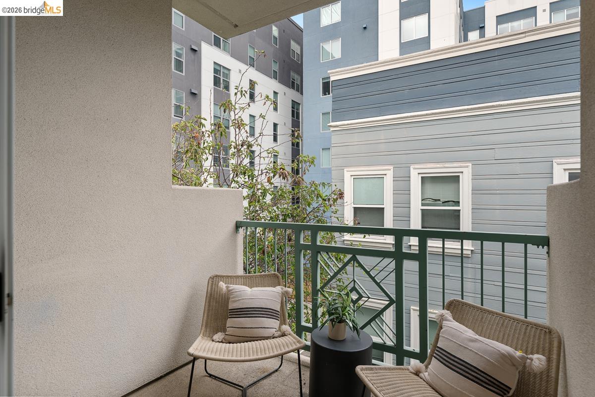 2029 Channing Way, Unit 3D Berkeley, CA 94704 - Photo 50 of 54 Private balcony featuring a textured stucco wall and decorative metal railing