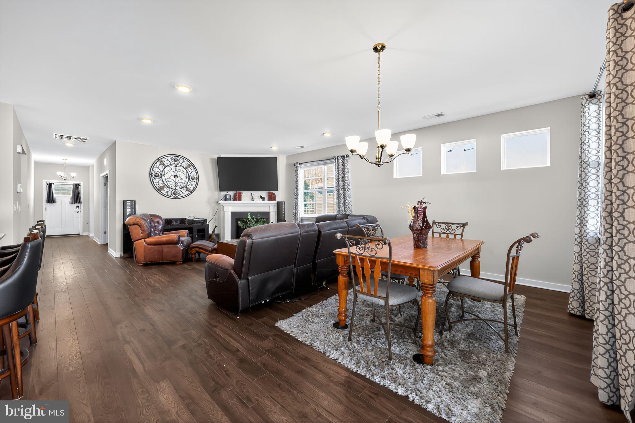 103 Congressional Court Moorestown, NJ 08057 - Photo 15 of 31 a living room with furniture a rug and a chandelier