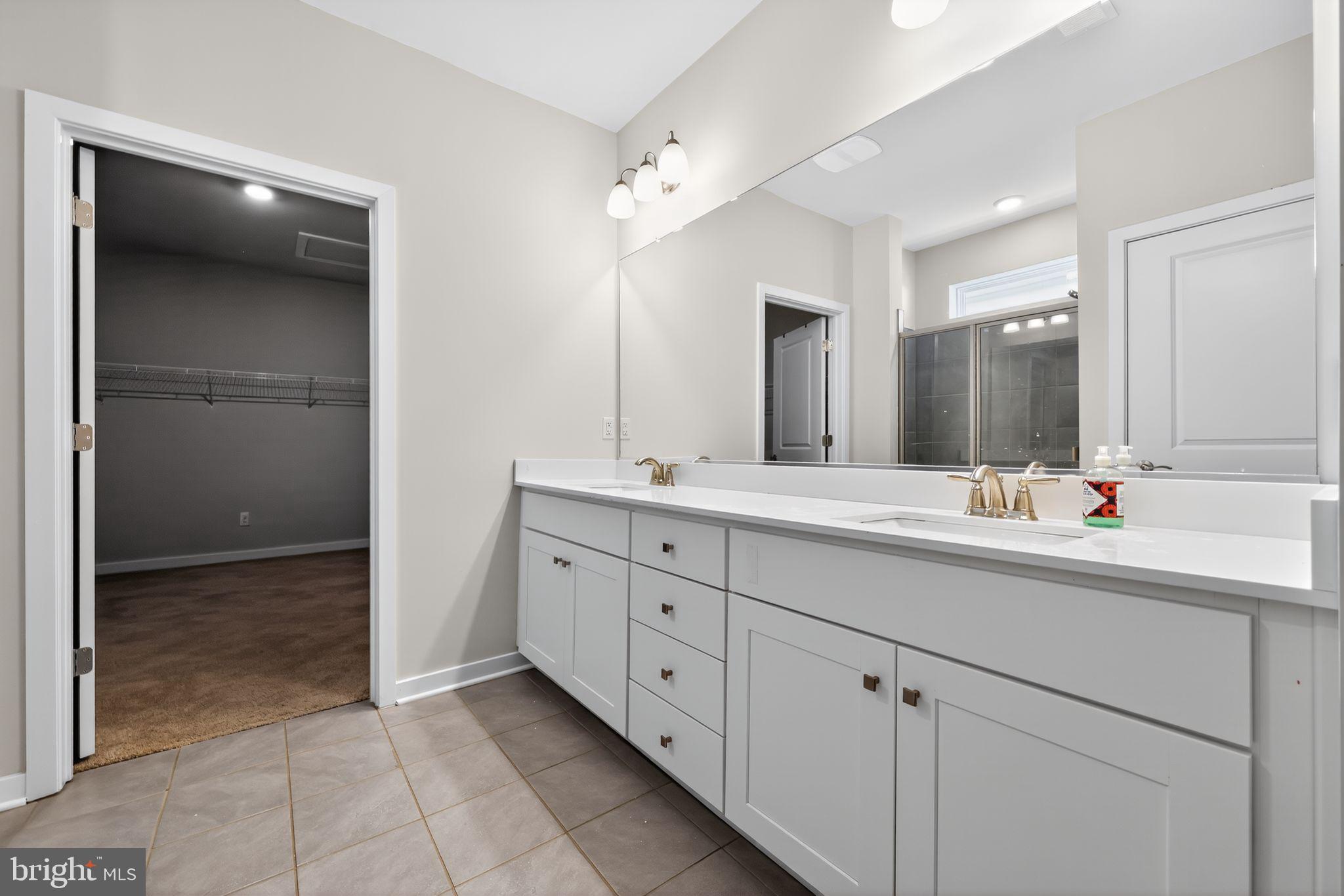 103 Congressional Court Moorestown, NJ 08057 - Photo 19 of 31 a bathroom with double sink and a mirror