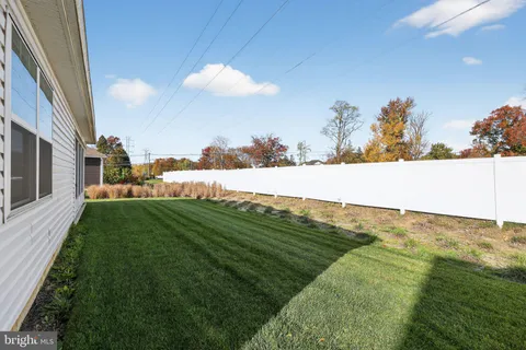 a view of a field with an ocean