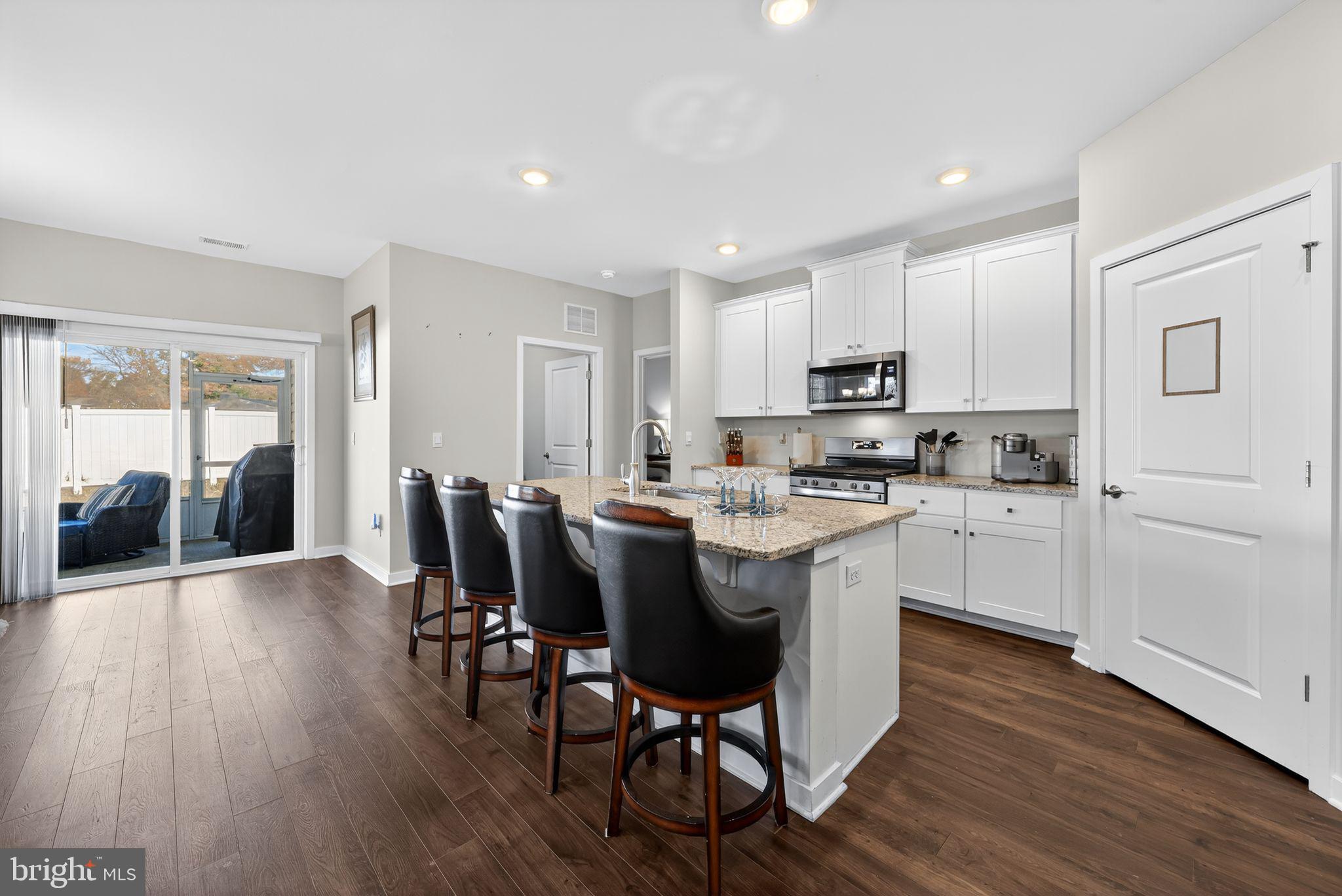 103 Congressional Court Moorestown, NJ 08057 - Photo 9 of 31 a kitchen with a table chairs refrigerator and cabinets