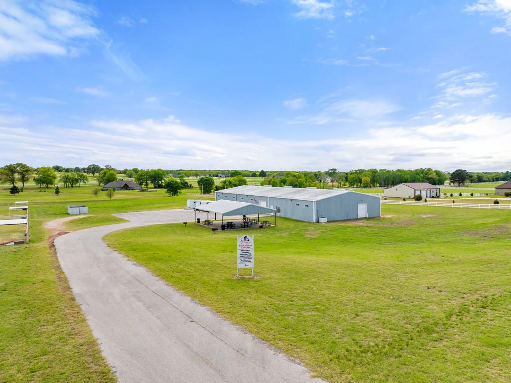 23630 Champion Drive Lindale, TX 75771 - Photo 35 of 36 a view of a lake with houses in the back