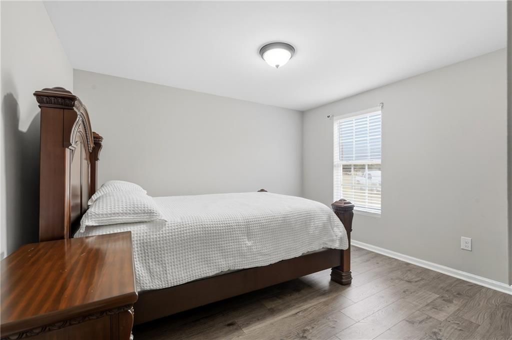 1295 Double Bridges Road Winder, GA 30680 - Photo 25 of 57 a bedroom with a bed and a window