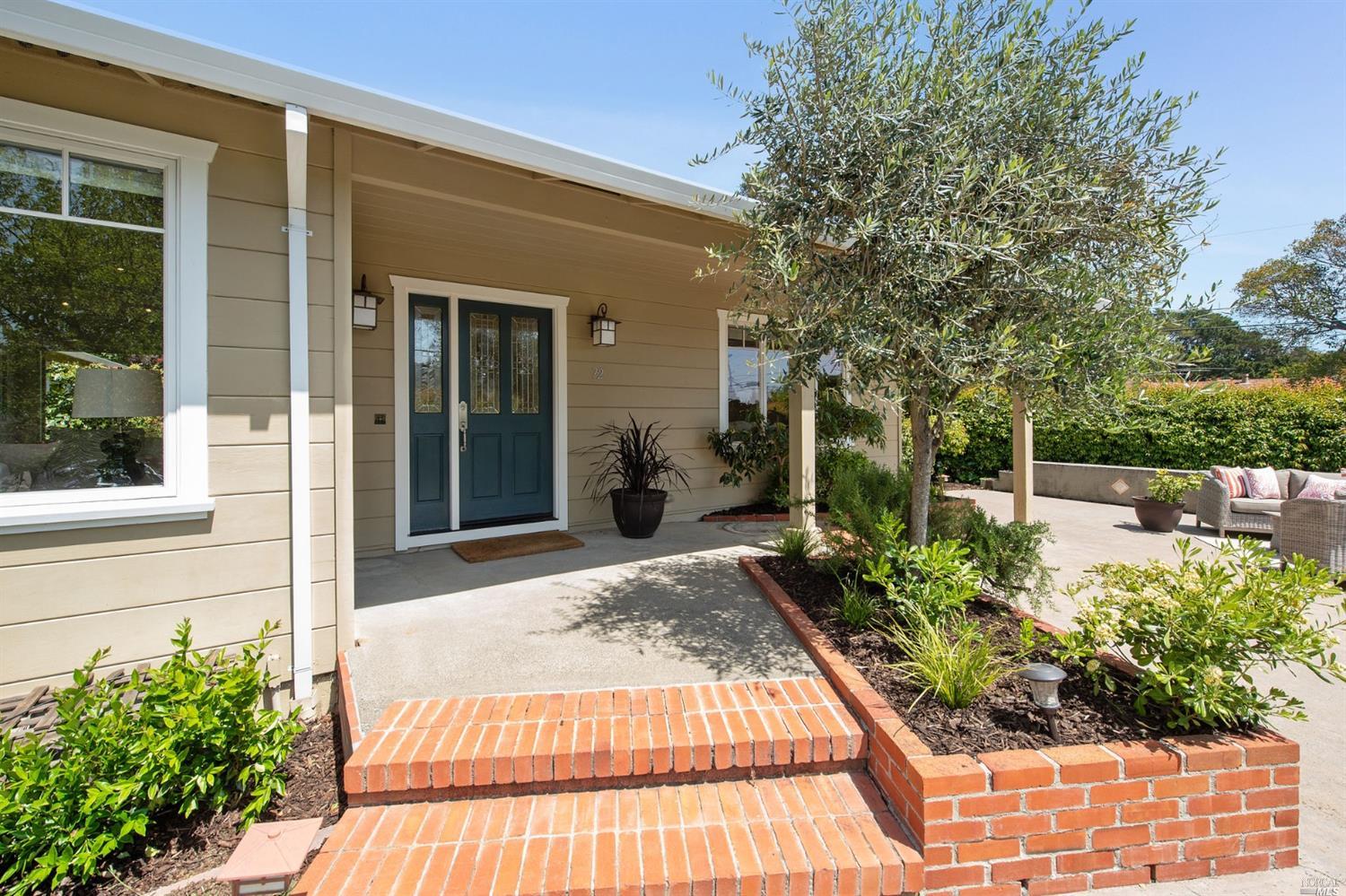 a view of a backyard with sitting area