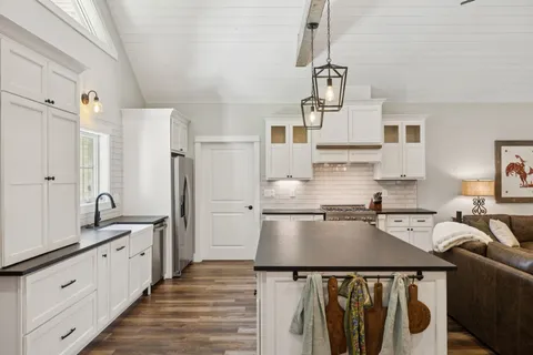 a bedroom with a bed and a chair