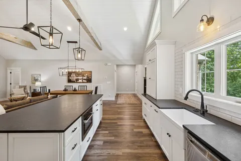 a view of walk in closet with clothes washer and dryer