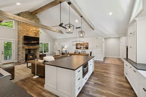 a bathroom with a sink a toilet and a window