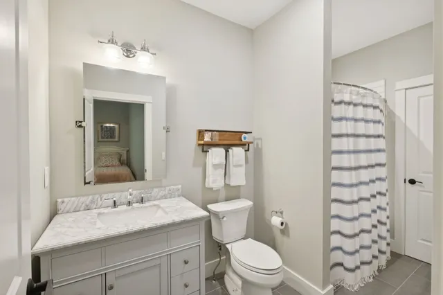 an aerial view of a house with yard and outdoor seating