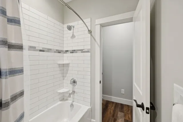 an aerial view of a house with yard