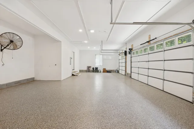 a backyard of a house with lots of green space and garden