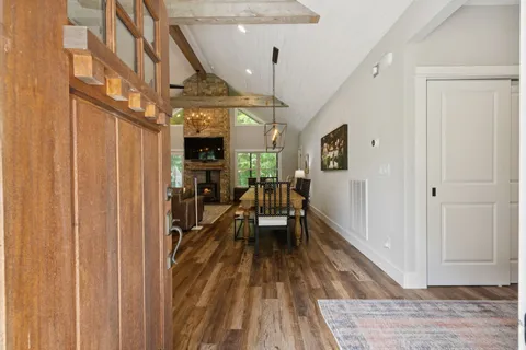 a living room with fireplace furniture and a flat screen tv