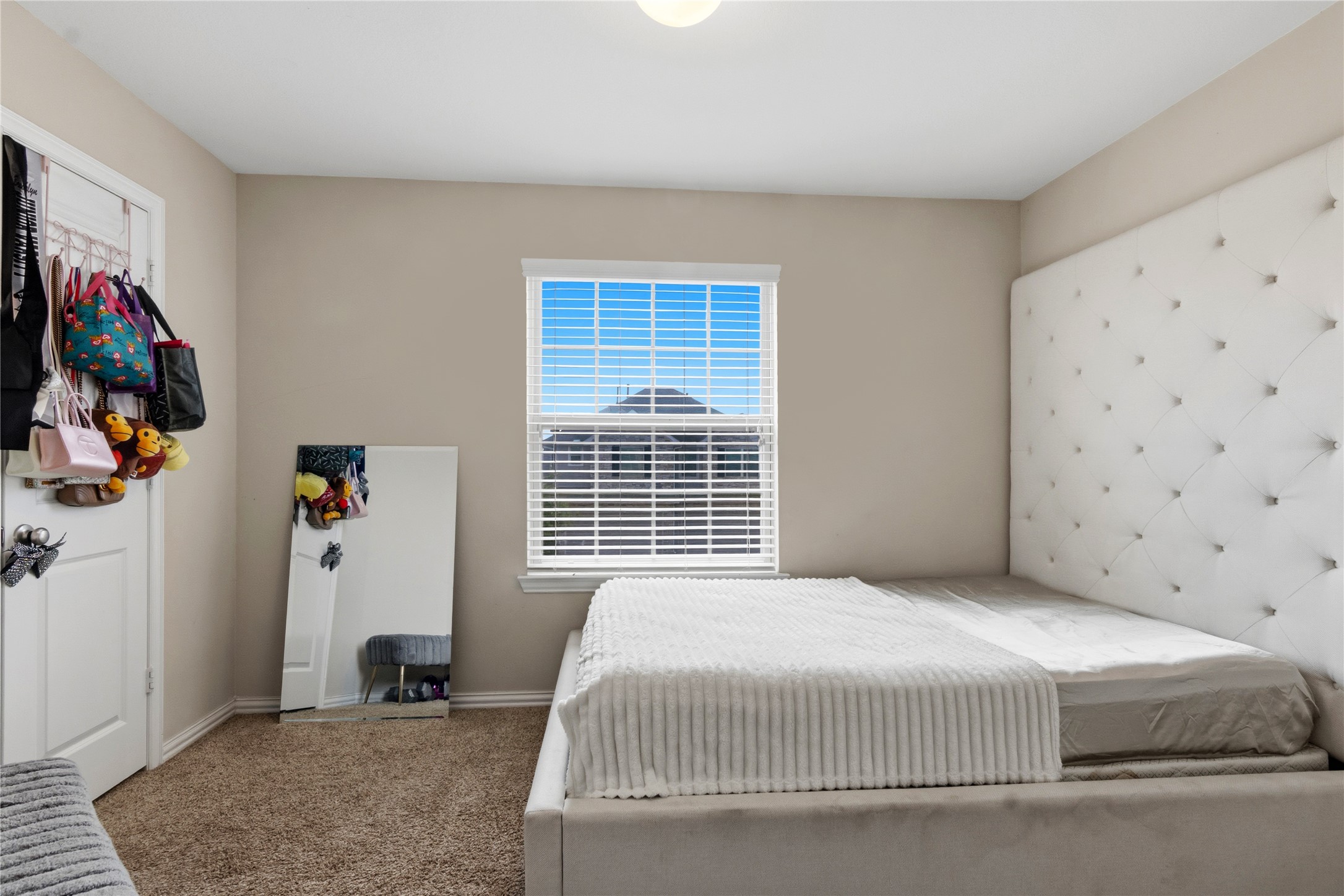 1815 Ryon Falls Drive Richmond, TX 77469 - Photo 18 of 24 a bedroom with a bed and a window