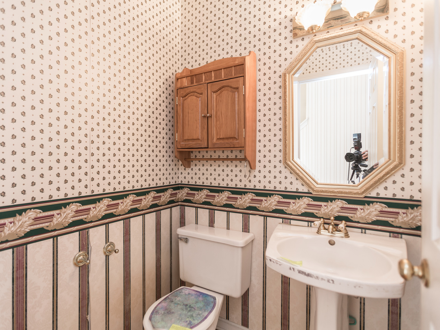 1415 Stonegate Road Algonquin, IL 60102 - Photo 18 of 49 a bathroom with a sink a toilet and a mirror