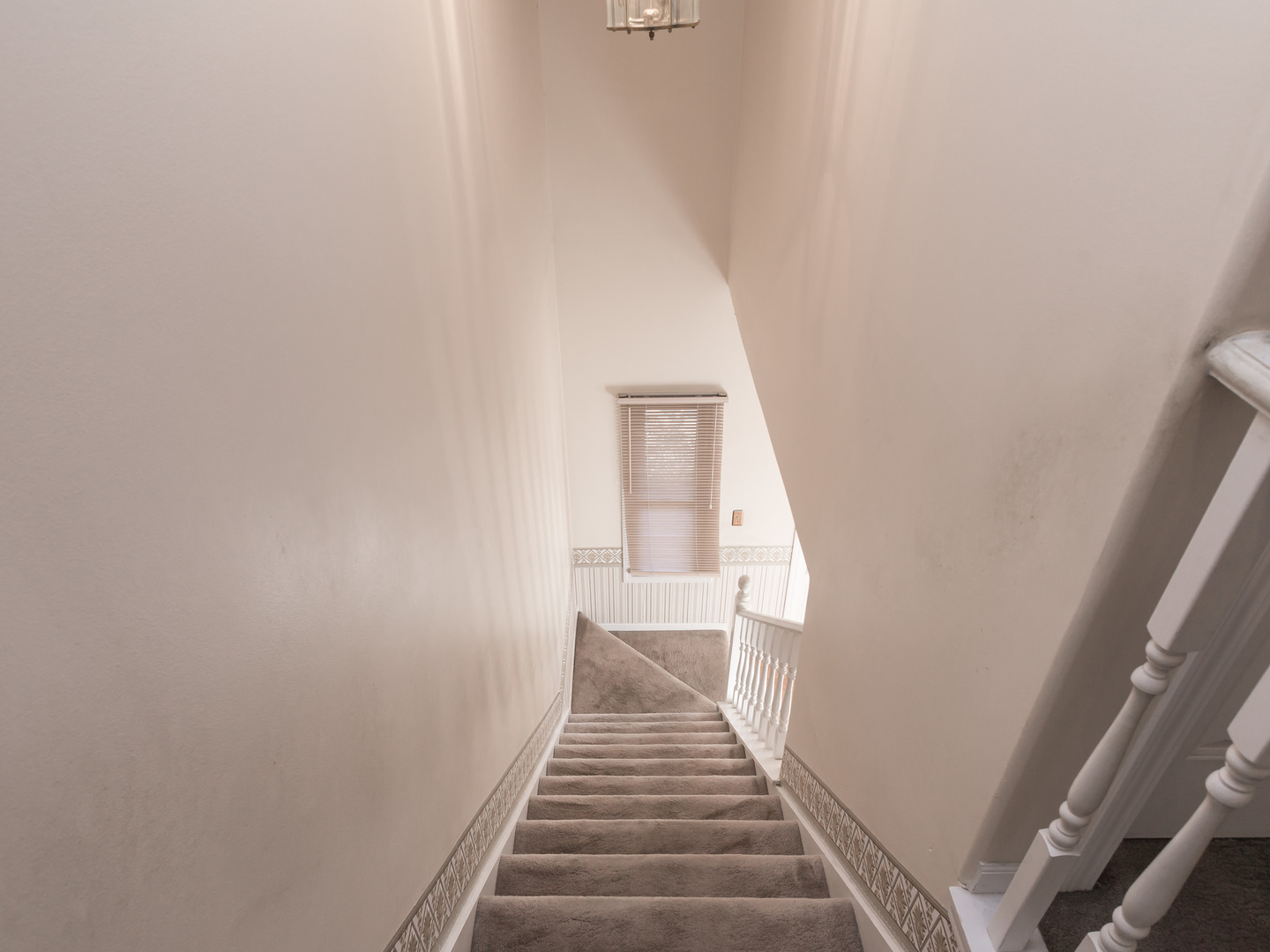 1415 Stonegate Road Algonquin, IL 60102 - Photo 19 of 49 a view of a hallway with wooden floor and staircase