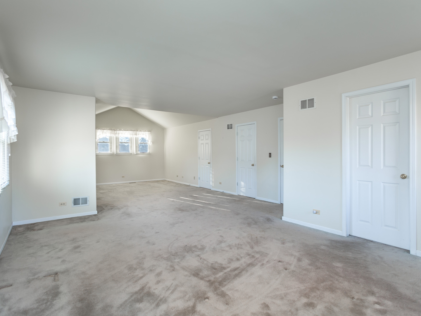 1415 Stonegate Road Algonquin, IL 60102 - Photo 20 of 49 an empty room with windows and entrance to other room